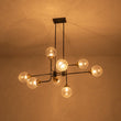 Load image into Gallery viewer, LightFixturesUSA - Soda Pop 8 - Light Seeded Glass Bubble Sputnik Linear Chandelier - Chandelier - Black + Brass -