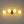 4-Light Brass Tiered Opal Glass Globe Linear Vanity Wall Sconce