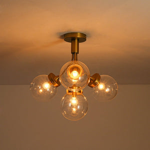 LightFixturesUSA - 4 - Light Bloom Clear Glass Globe Semi Flush Mount - Ceiling Light - Brass - 